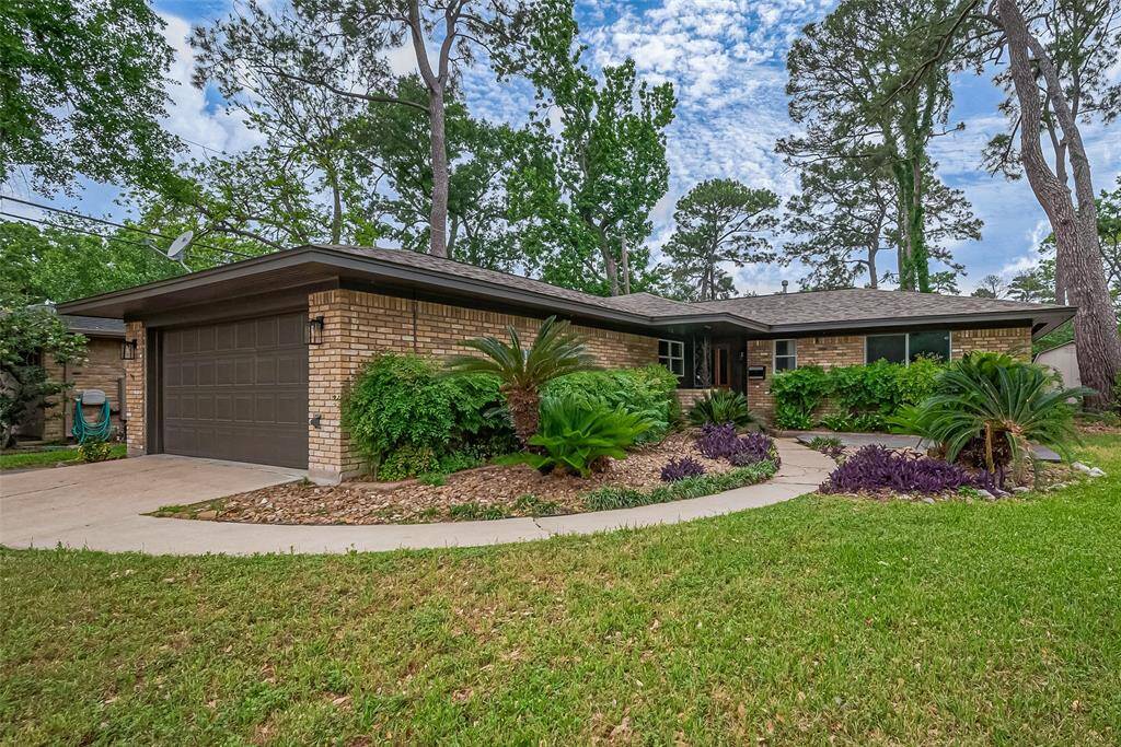 This lovely Spring Branch 3 bedroom 2 bath Brick home has been updated with new Garage Lights and Urbane Bronze Paint.
