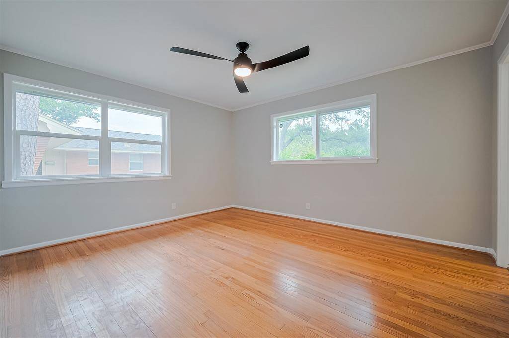 Primary bedroom has two large windows for plenty of natural light. Did someone say plantation shutters? Why yes - that could be perfect! Make this bedroom your own.