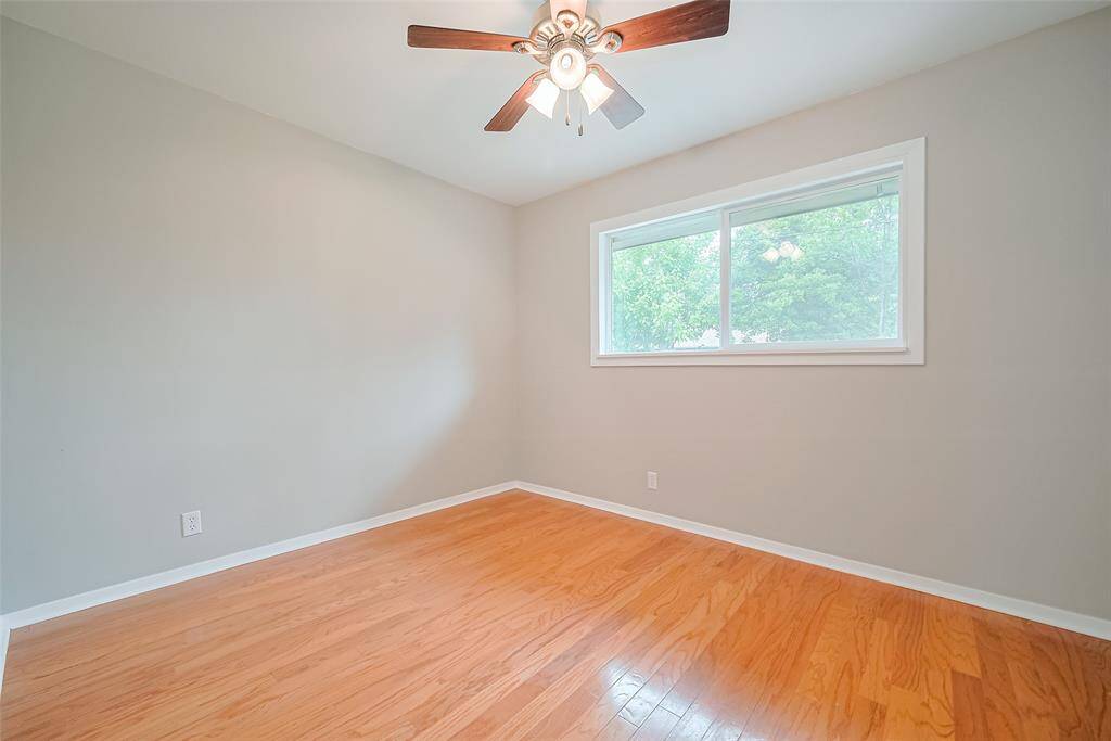 2nd bedroom with lots of natural light and ceiling fan.
