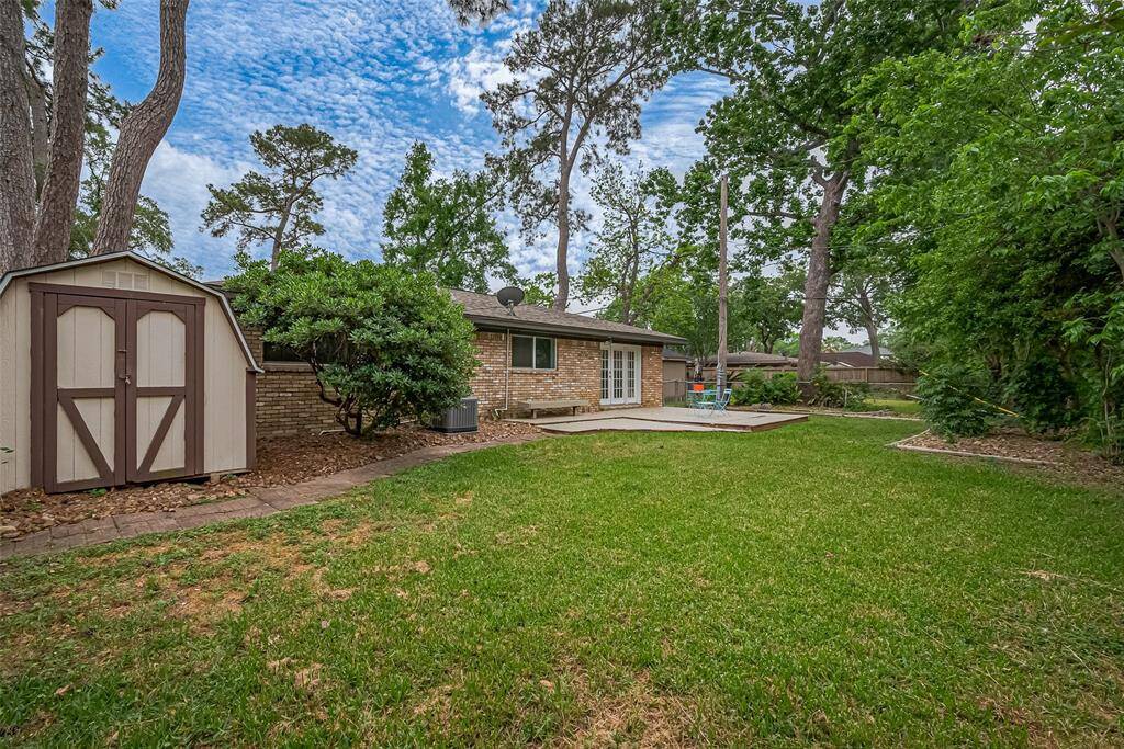 Huge backyard with storage shed.