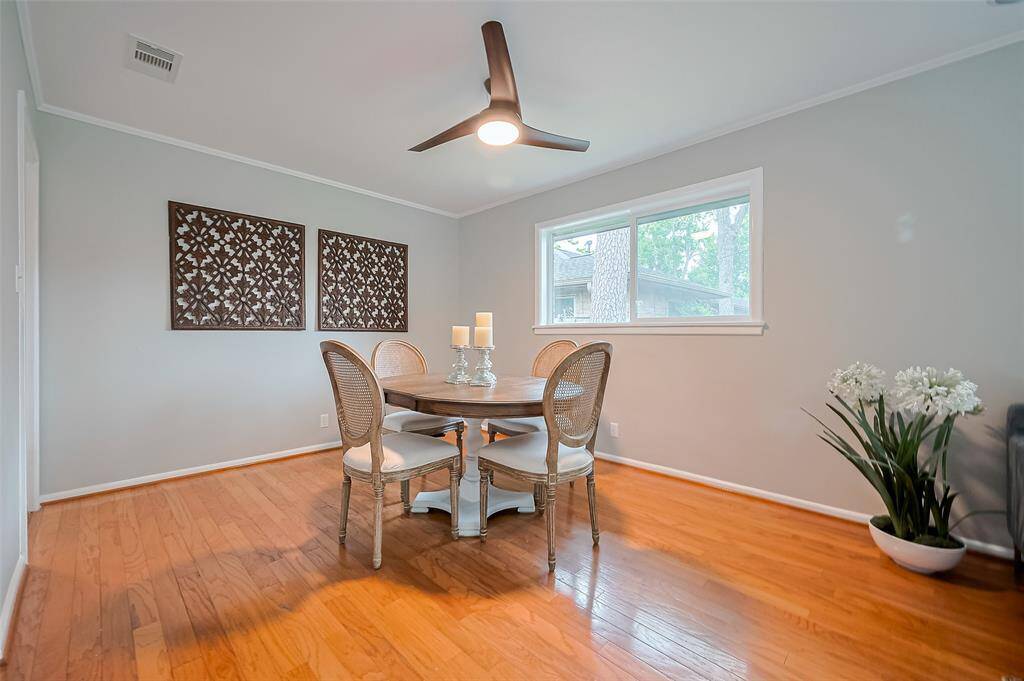 Plenty of room for a sideboard or a hutch in this dining room.