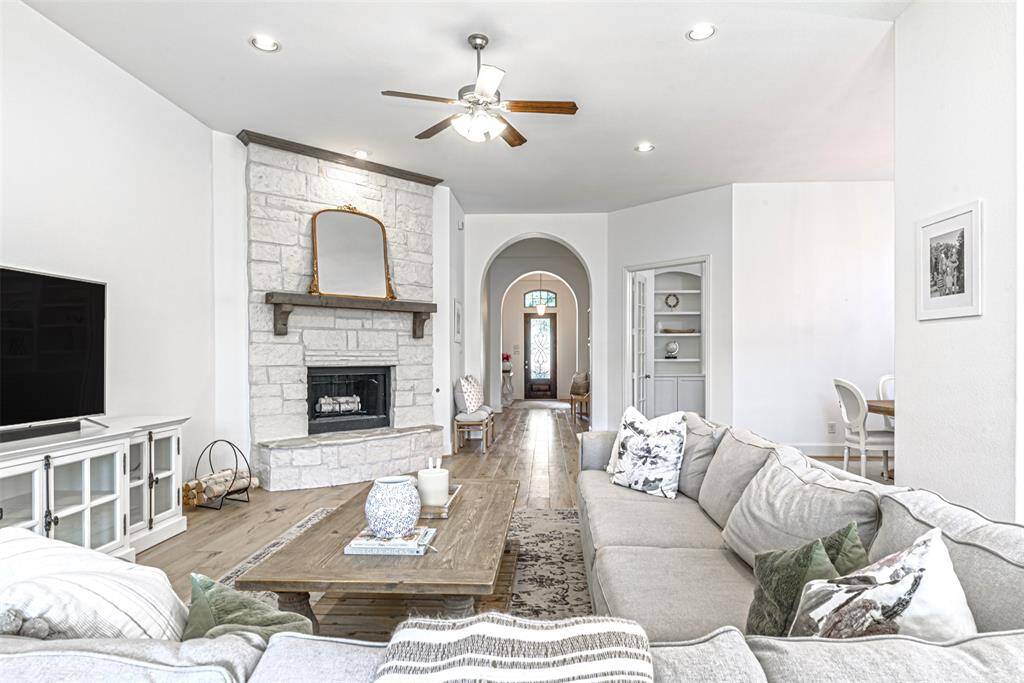 Reverse view of the family room with long hallway leading to the entrance