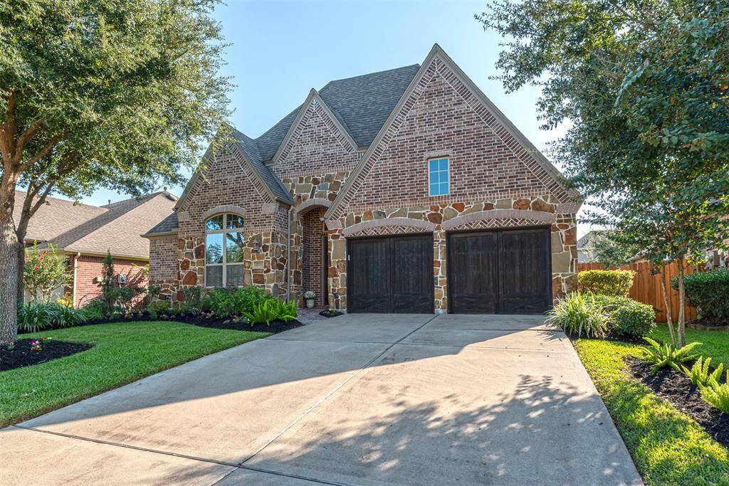 Two car garage with wooden doors