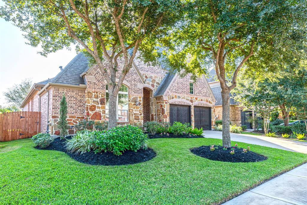 Beautiful curb appeal and fully grown trees in front of the home