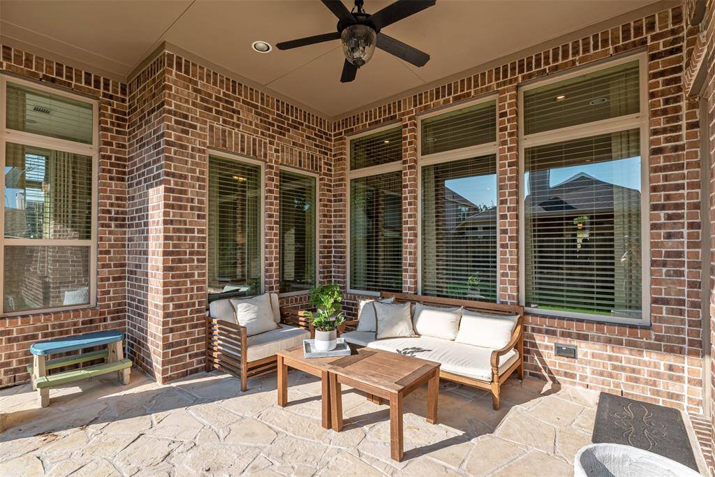 Covered patio with ceiling fan and finished flooring