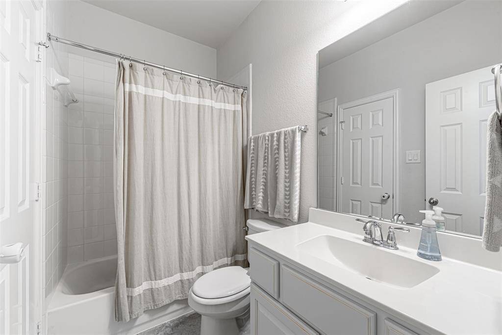 One of three full bathrooms