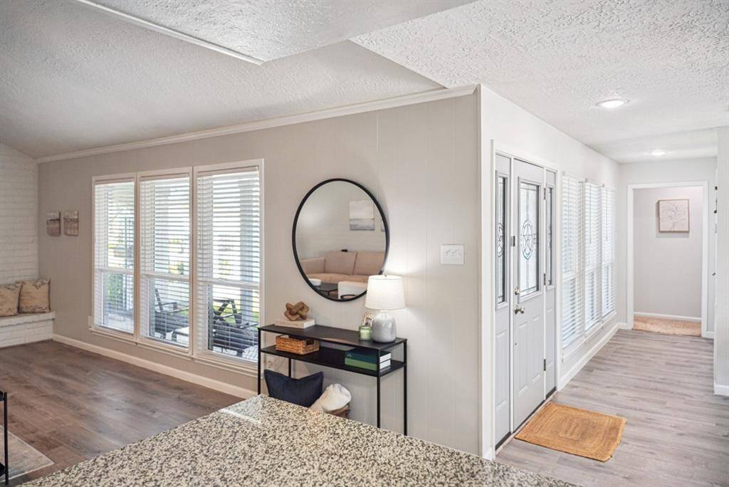 Main Living Area – Another angle showcasing the open floor plan and vaulted ceilings.