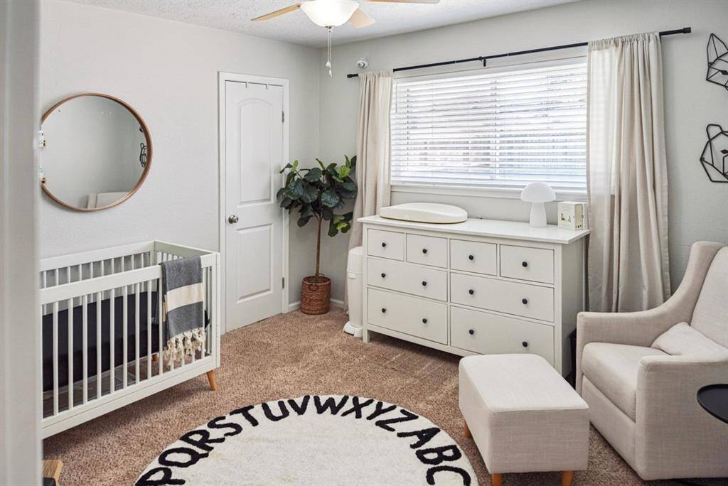 Secondary Bedroom – Bright and inviting with neutral tones, perfect for a nursery or guest space.