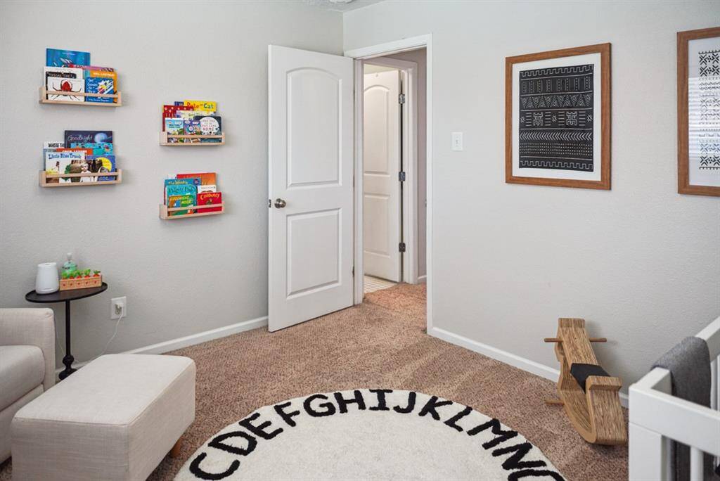 Additional Bedroom – Cozy space with custom shelving, ideal for a child’s room or office.