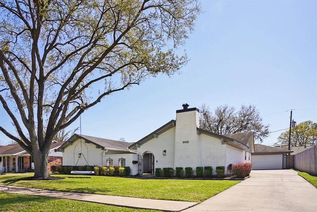 Alternate Front View – Beautiful curb appeal with a well-maintained lawn and shaded sidewalk.