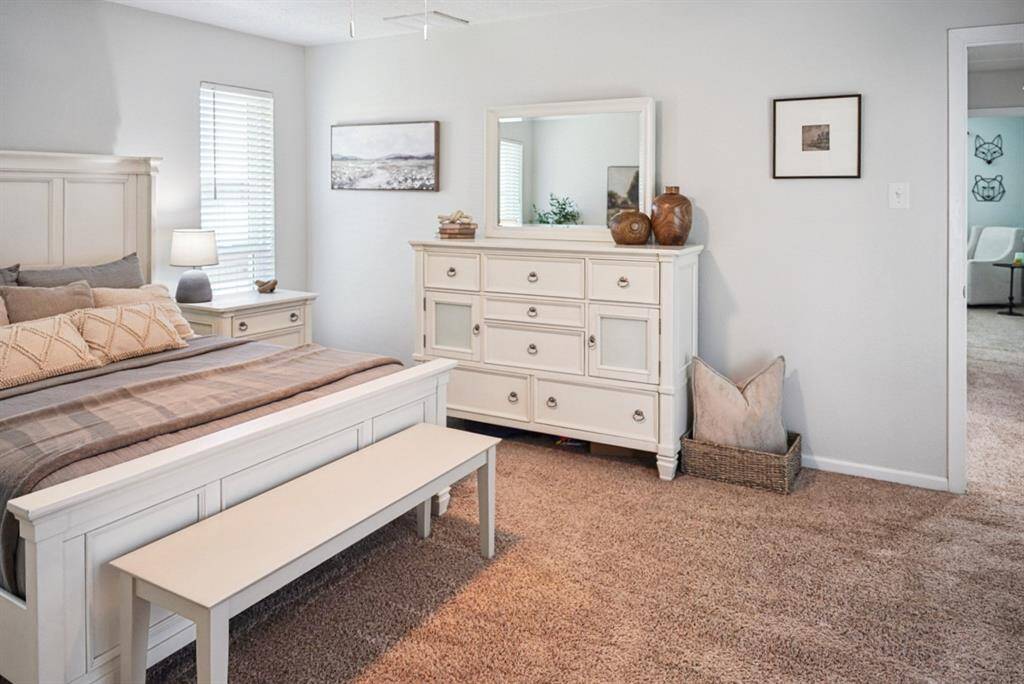 Primary Bedroom Alternate View – Bright and open with a walk-in closet and en-suite bath.