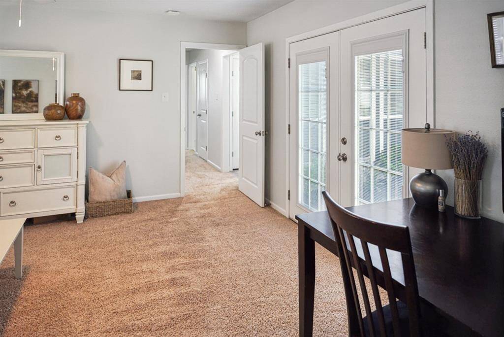 Hallway & French Doors – Private access leading to outdoor space with natural light.