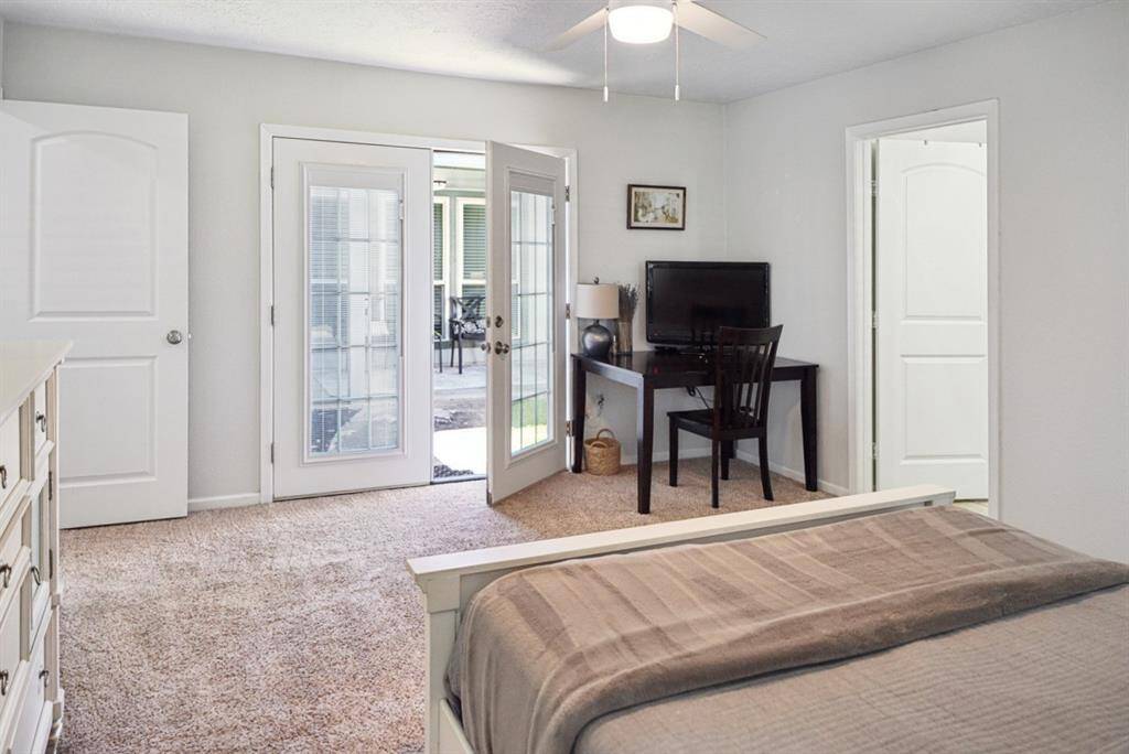 Primary Bedroom with French Doors – Private access to outdoor space, bright and spacious layout.