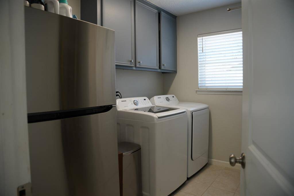Laundry Room – Dedicated space with built-in storage and room for extra appliances.