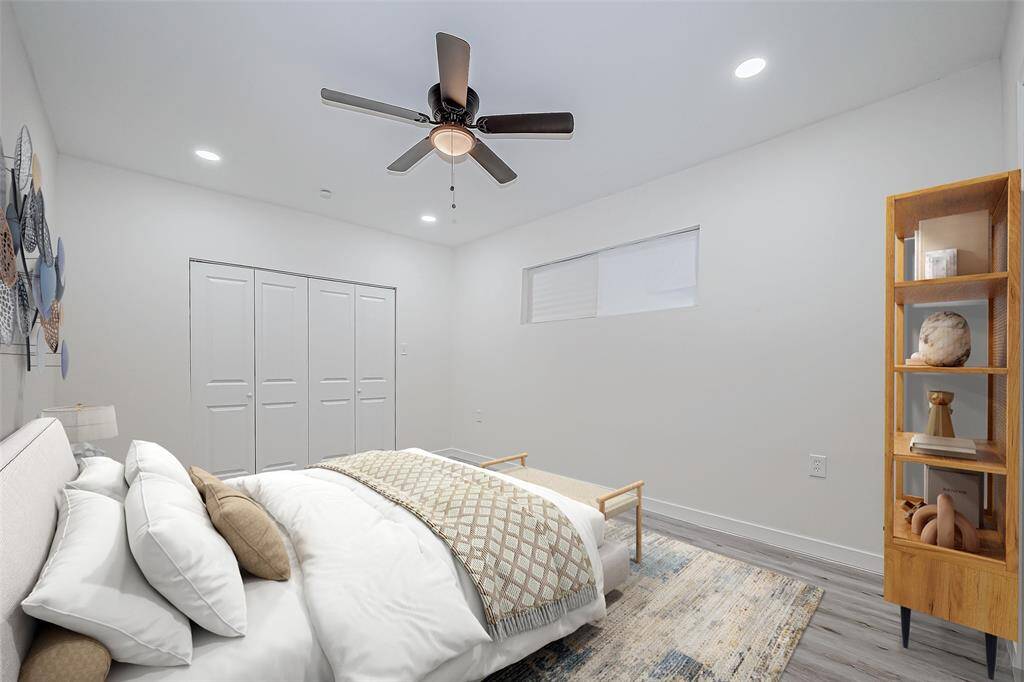 The virtually staged primary bedroom offers a clear vision of the space’s potential, allowing you to easily imagine how it could be transformed into your personal sanctuary.