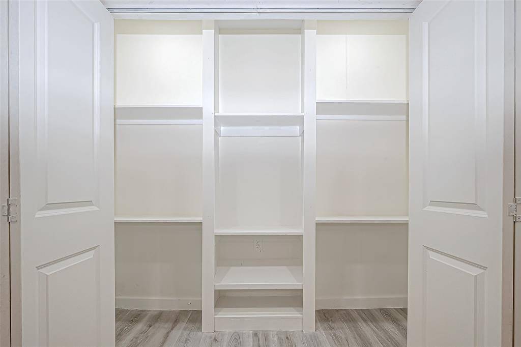 The full entry closet is both spacious and practical, featuring built-in shelves that offer convenient storage and organization. Whether it's for coats, shoes, or everyday essentials, these shelves provide a tidy and accessible solution to keep your entryway neat and clutter-free.
