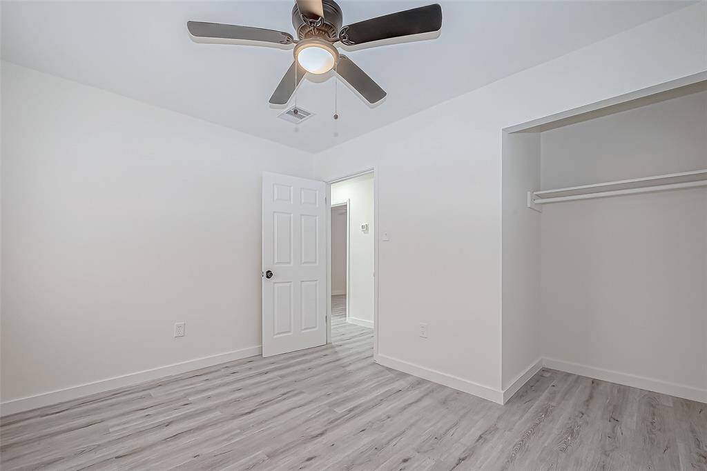 The bedroom is a bright and inviting space, thoughtfully designed for comfort and relaxation.