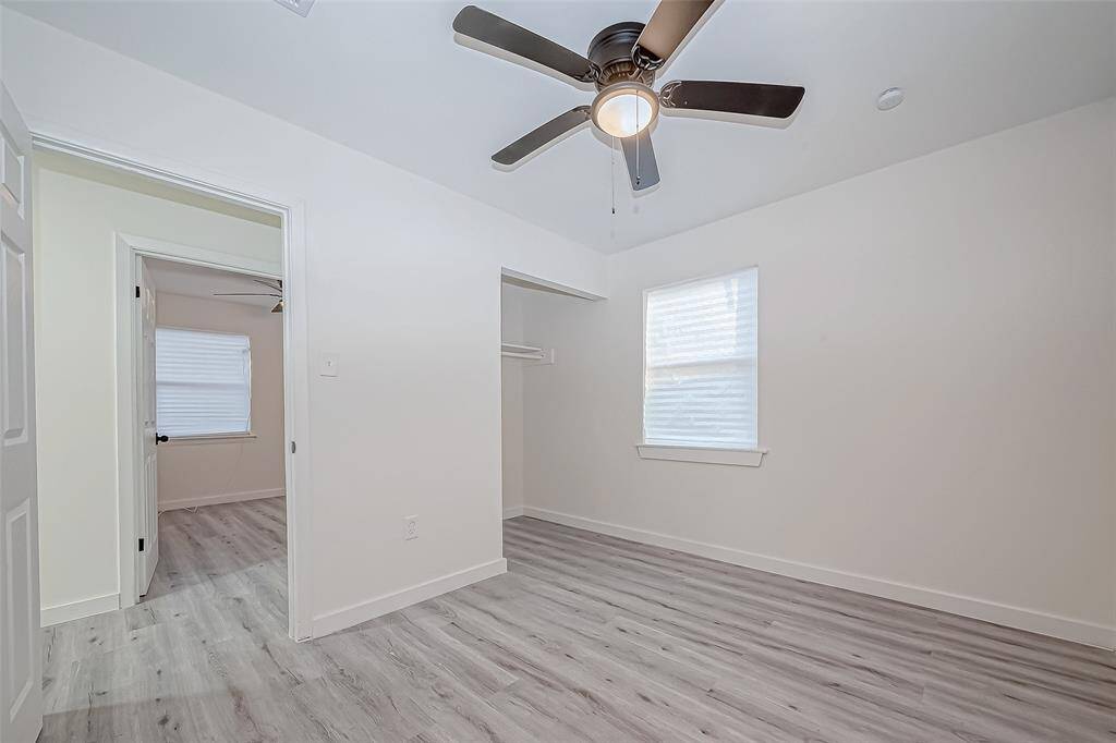 The sleek vinyl flooring flows seamlessly throughout, offering both durability and easy maintenance.