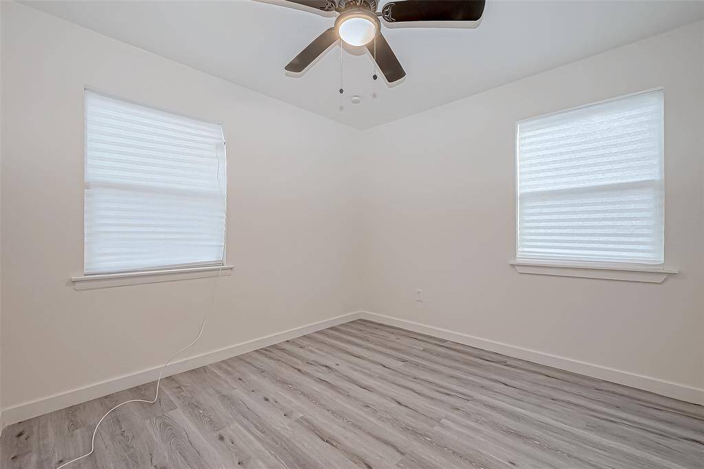 Large windows allow plenty of natural light to fill the room, making it feel open and airy