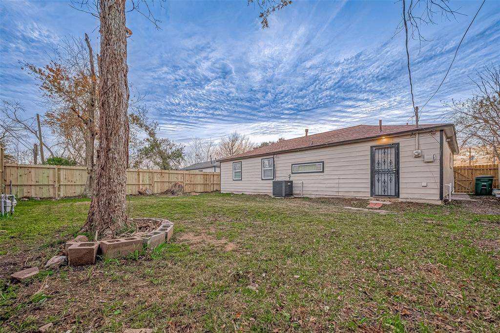 The backyard is a standout feature of the property, offering a generous expanse of outdoor space perfect for relaxation, play, and entertaining.
