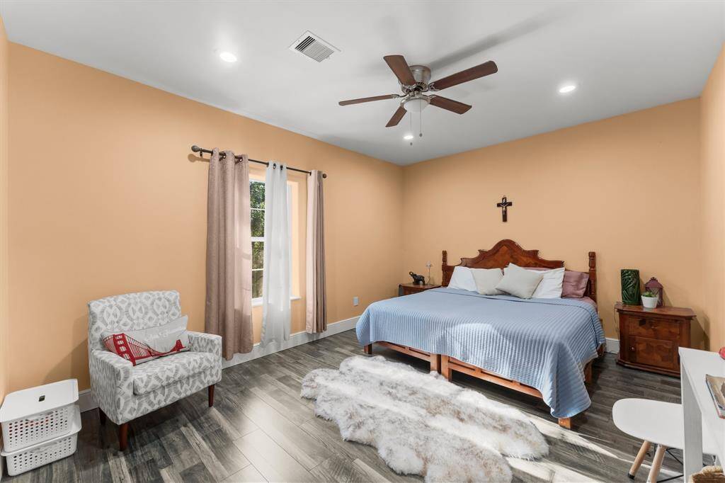 Enjoy the natural light that fills this cozy bedroom, creating a warm and inviting ambiance. The ceiling fan provides added comfort, making it a perfect space to unwind.