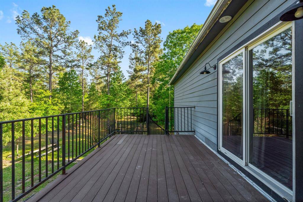 Step out onto this inviting deck and immerse yourself in the natural surroundings. It's the perfect spot to enjoy your morning coffee or evening sunsets amongst the trees.