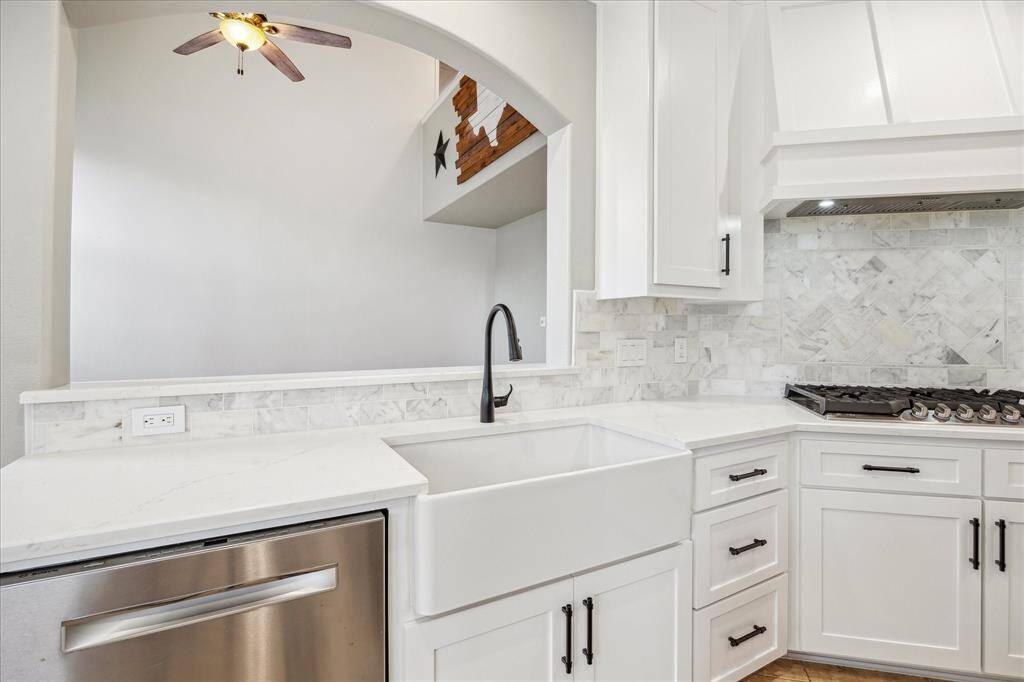 Custom apron sink and stunning backsplash!