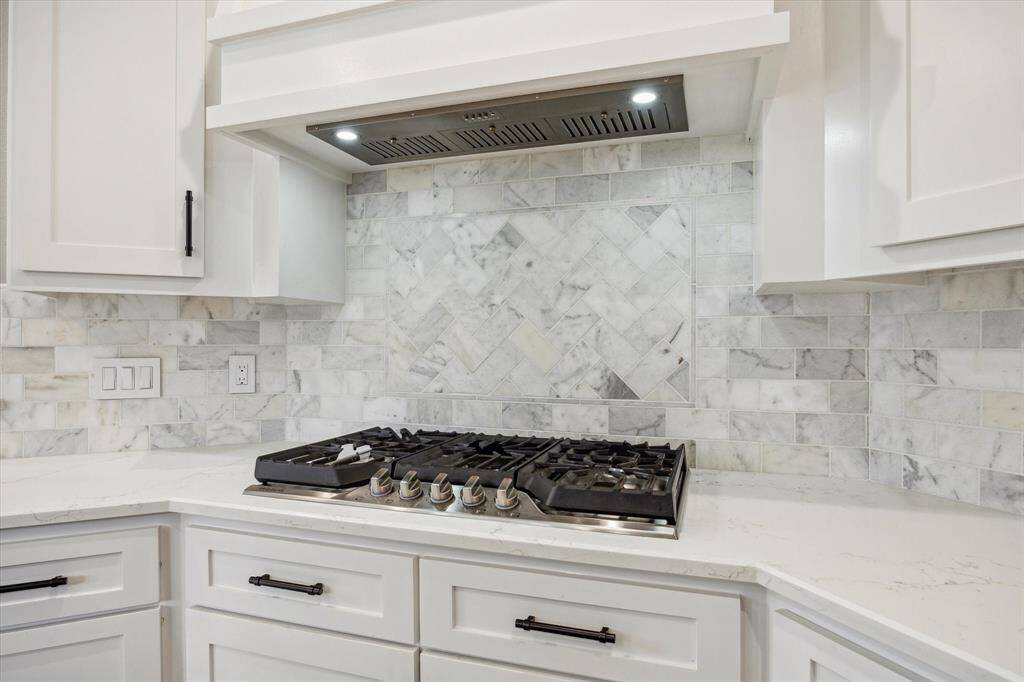 Large 5 burner gas cooktop and custom built hood vent!