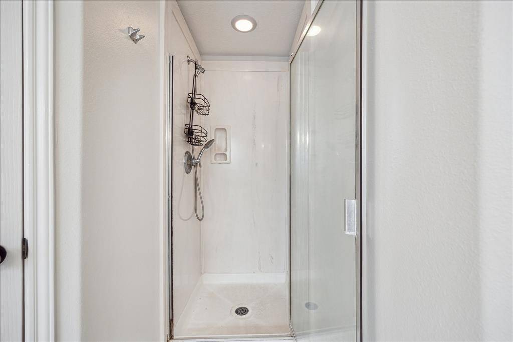 Separate shower in the primary bathroom.