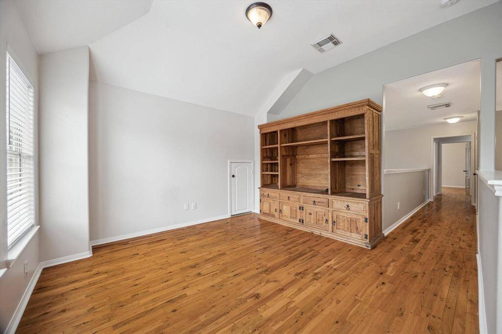 Gameroom with tons of natural light and real hardwood floors!
