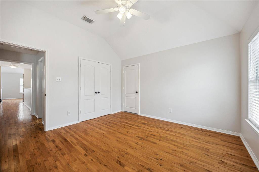 Secondary bedroom with real hardwood and walk in attic space!