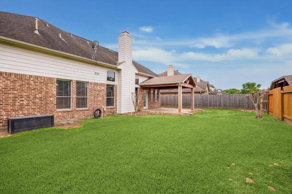 Just enough backyard space for activities and a small pool!
