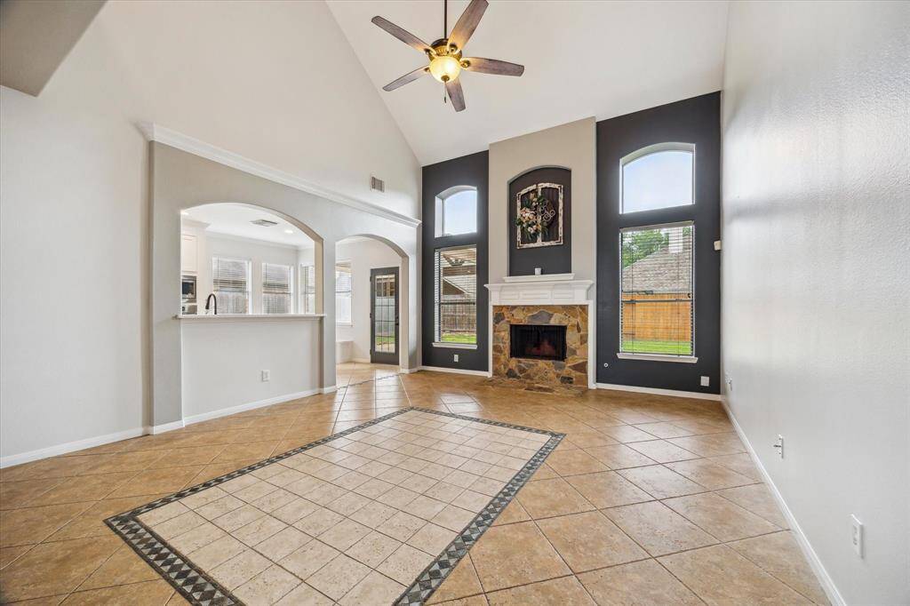 The family room is stunning with a custom stone fireplace to cozy up next to during the holidays!