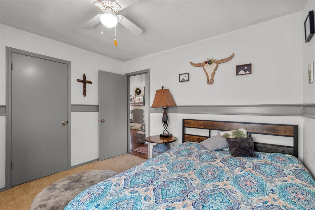 A sleek and inviting second bedroom with a queen bed, complemented by modern, minimalist decor. The room features soft, neutral colors and contemporary touches, creating a tranquil and stylish retreat for restful nights.