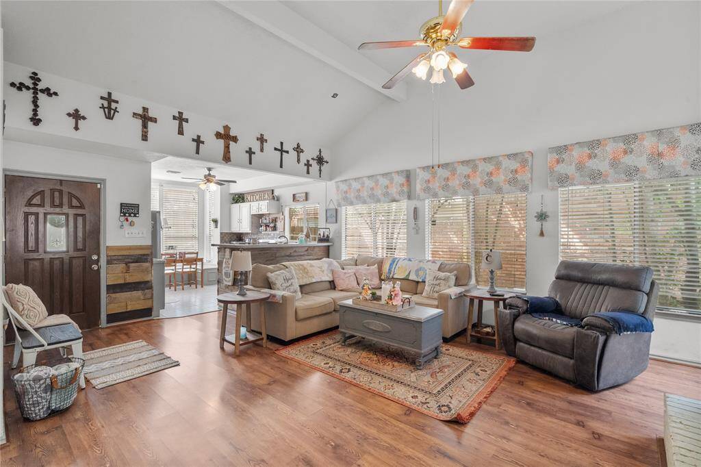 The open layout flows seamlessly into the kitchen, perfect for relaxing or entertaining in style.