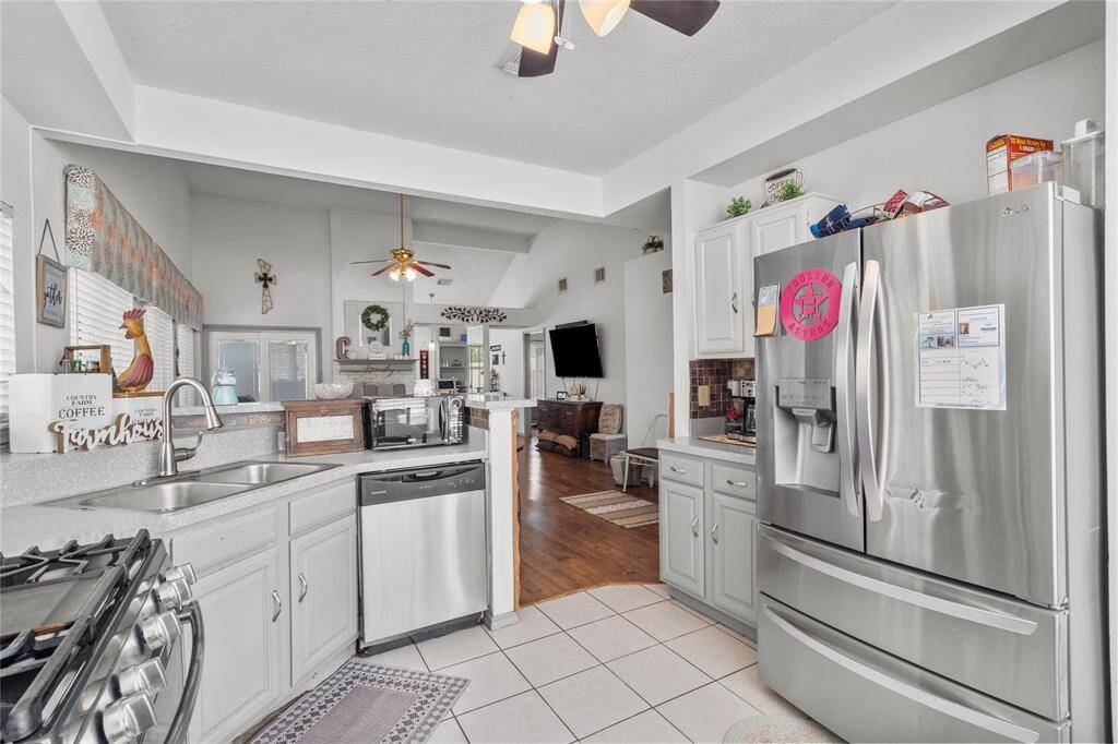 Relax by the gas fireplace in this inviting living room, and just off to the side, you'll find a versatile flex space—perfect for a home office, reading nook, or small room to suit your needs.
