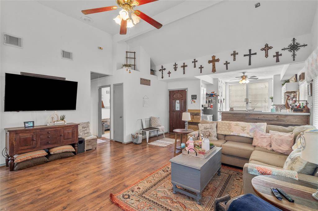 Imagine enjoying your morning coffee or a family meal in this charming kitchen nook, where natural light pours in through the window. The built-in seating not only provides a cozy spot to relax but also offers hidden storage underneath—perfect for keeping your kitchen organized and clutter-free.