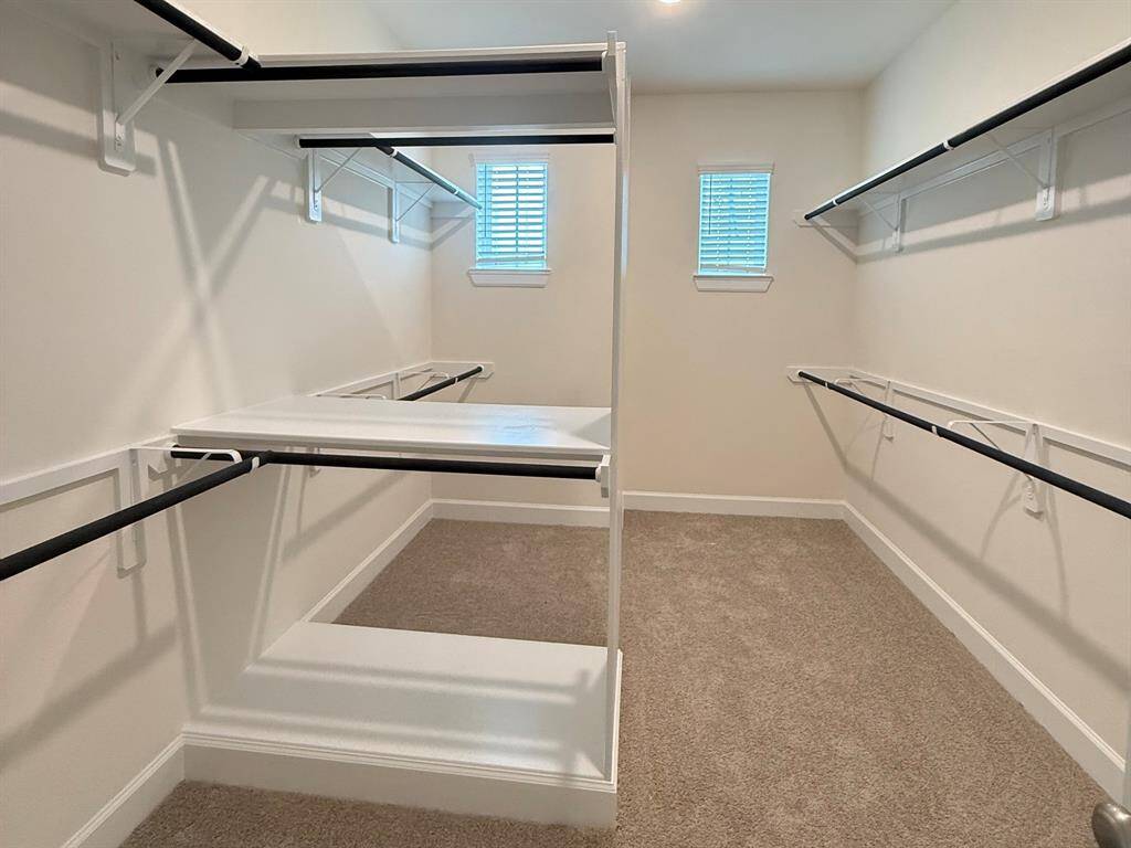 Walk-in closet in primary suite
