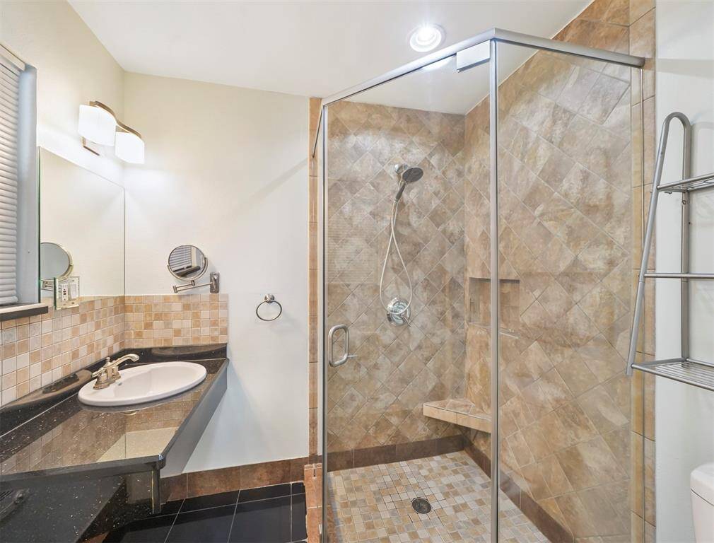The main bath has also been upgraded with lots of custom tile.