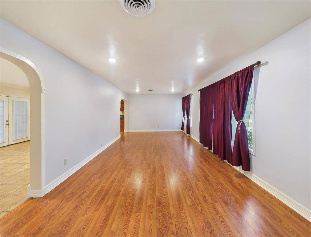 A wide view of the living space allowing for flexible furniture placement.