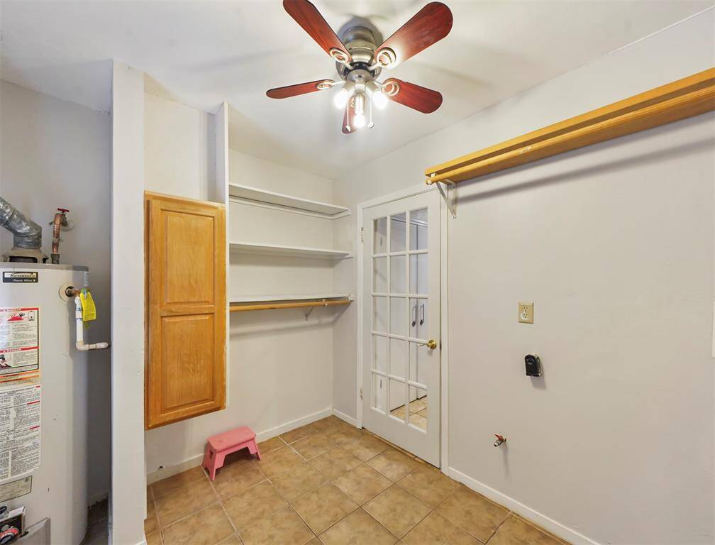 The laundry space has plenty of hanging space and storage. Bring your washer and dryer and connect and you're set.