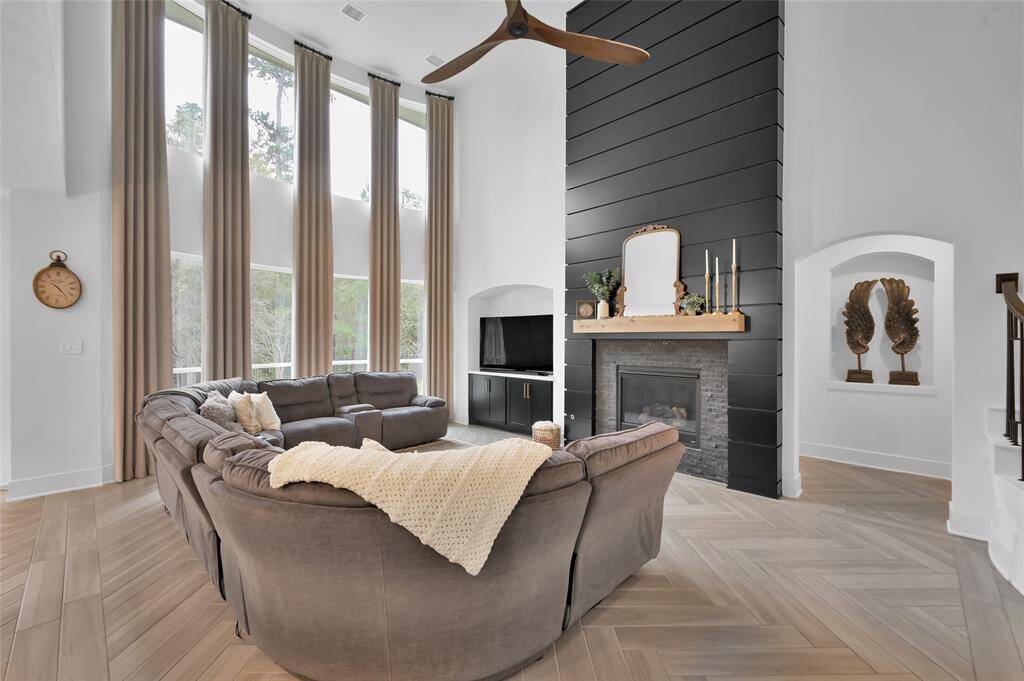 CUSTOM floor to ceiling fireplace w/ mantel and builtins added to living area nook.