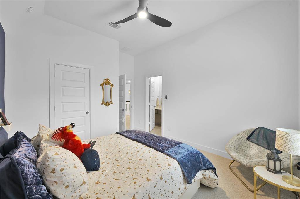 Secondary bedroom #2 located upstairs w/ shared bathroom w/ game room.