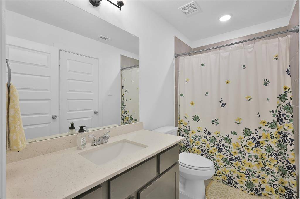 Shared bathroom between game room area and secondary bedroom #2.