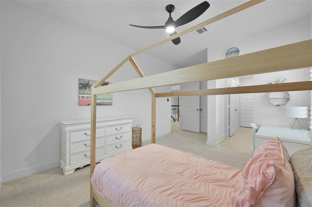 Secondary bedroom #3 is located upstairs and offers a Jack/Jill style bathroom shared with secondary bedroom #4.