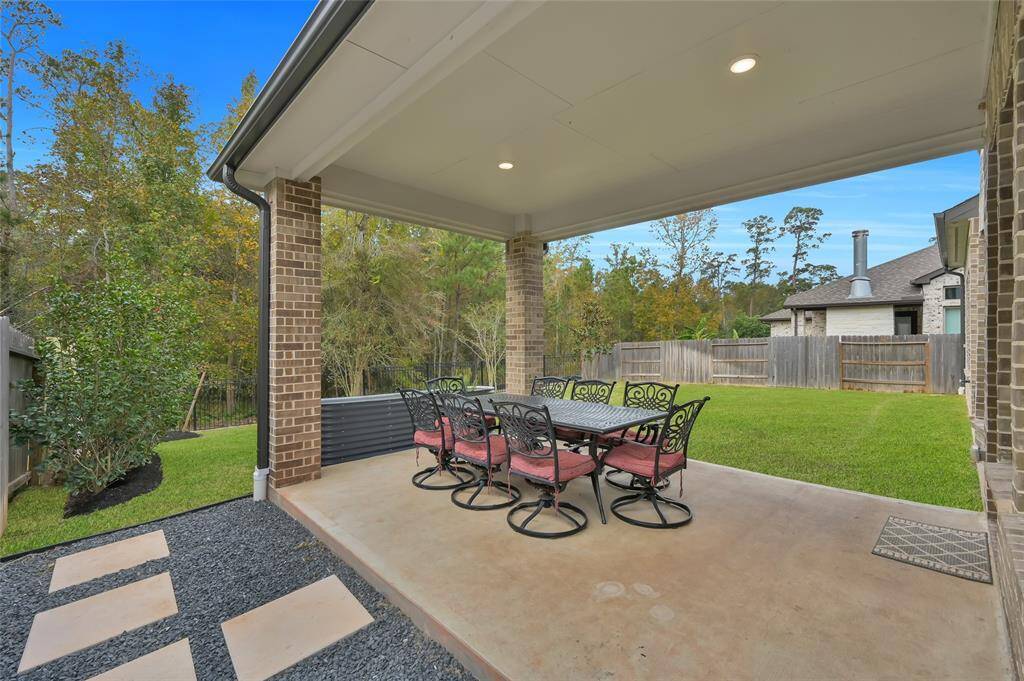Exterior upgrades include, but are not limited to, an extended covered patio, whole house gutters, underground pipes connected to the gutters for drainage, upgraded landscaping (trees, shrubs, black star rock, pavers, etc), storage shed, and they're all enjoyed with the view of NATURE!  No rear neighbors!