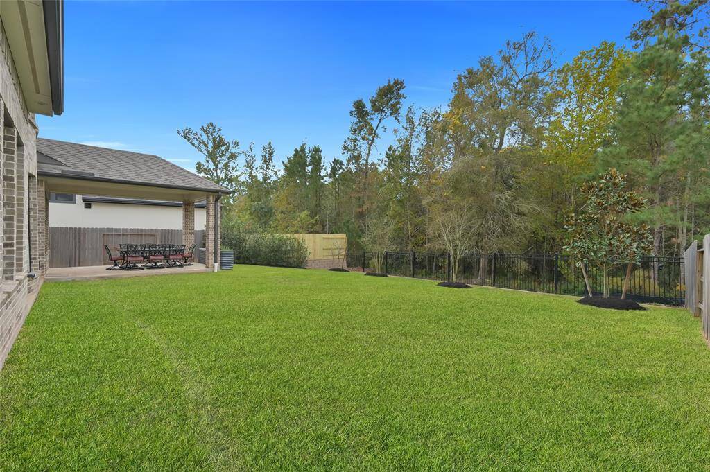 Exterior upgrades include, but are not limited to, an extended covered patio, whole house gutters, underground pipes connected to the gutters for drainage, upgraded landscaping (trees, shrubs, black star rock, pavers, etc), storage shed, and they're all enjoyed with the view of NATURE!  No rear neighbors!