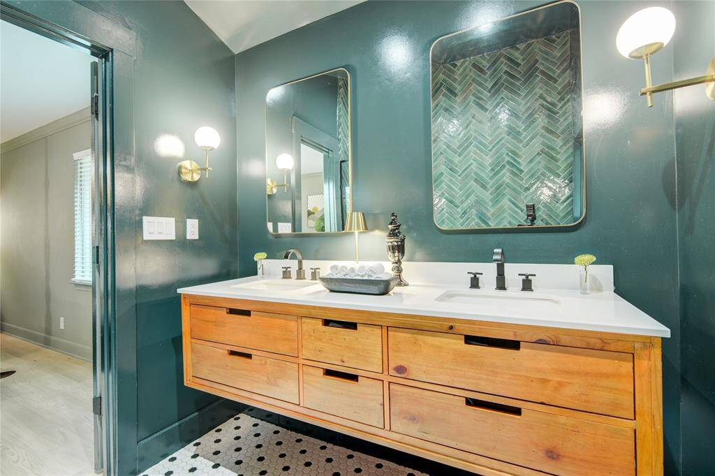 Primary en suite updated with modern conveniences and a vaulted ceiling.