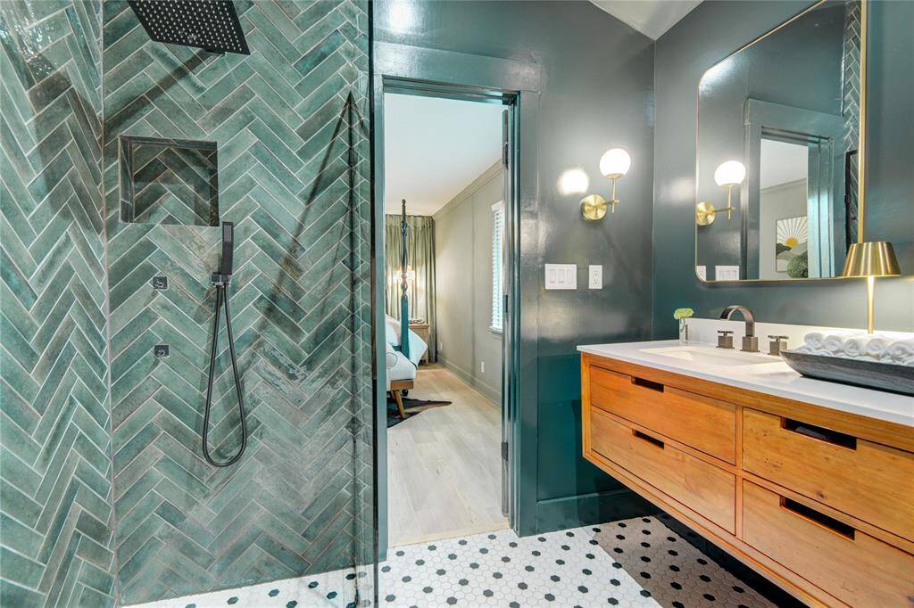 Enjoy the curbless zero entry shower with designer tile and fabulous rain head fixture.
