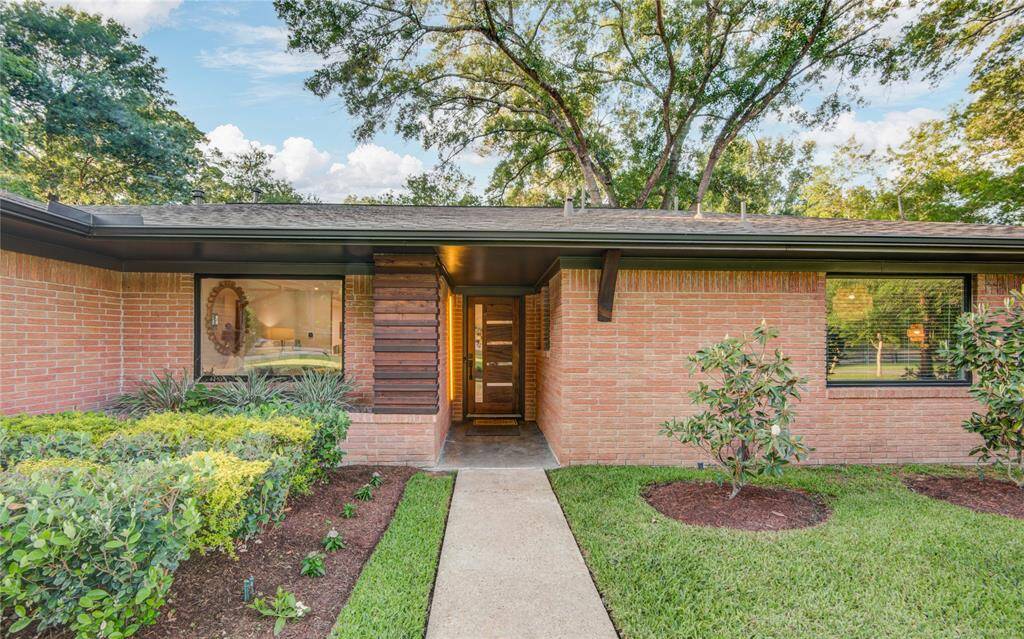 Step inside through the custom designed mahagony front door.